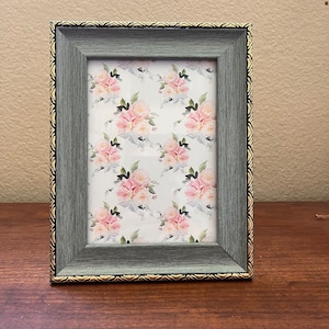 Vintage 9x7 gray wood frame with gold and black detail holds a 5x7 image