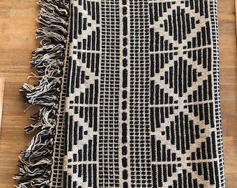 Recycle cotton diamond patterned fringed, throw black and beige in color  50 x 60”