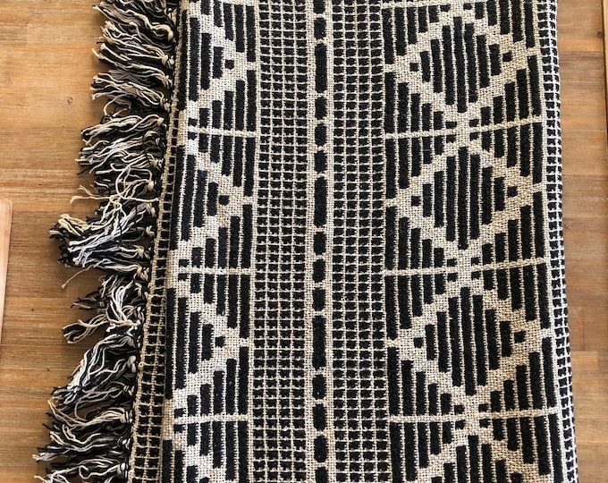 Recycle cotton diamond patterned fringed, throw black and beige in color  50 x 60”
