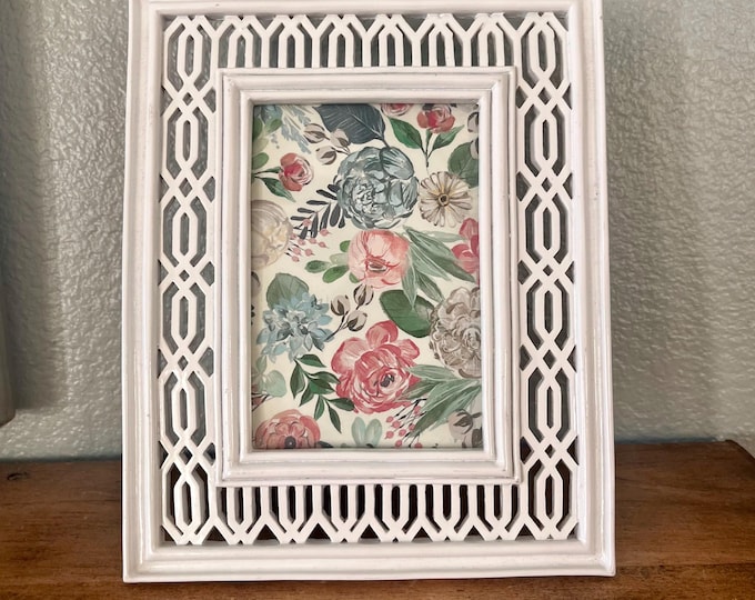 Vintage white wood frame with ornate detail holds a 3 1/2"x 51/2" inch image