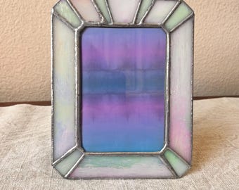 Vintage silver pink and blue stain glass frame 7 1/4 "x 5 1/2 "holds a 3 1/4" x 4 3/4" image.