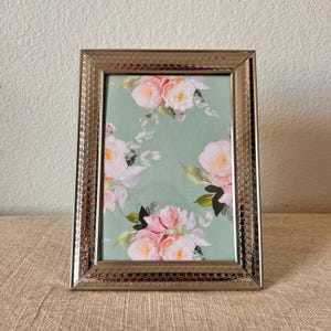 Vintage 5 x 7 silver frame with ornate detailing holds 4 1/2”x 6 1/2 image