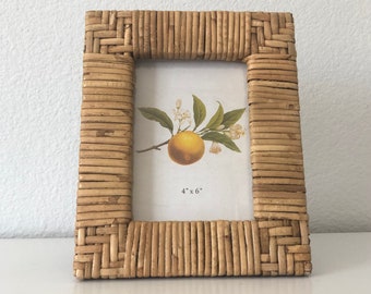Hand woven rattan  8 1/2" x 7" frame holds a 4x6 image. Hangs and stands both horizontally and vertically