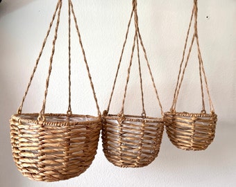 Hanging Water Hyacinth Planters with plastic liners and jute rope hangers comes in  3 sizes. Holds 9", 8" & 6" Pots
