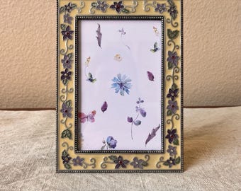 Vintage silver and butter colored enamel frame with floral and rhinestone details.