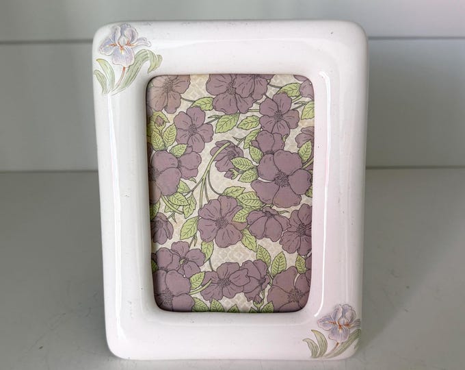 Vintage white 5 1/2"x 6 1/2" frame with flower details holds a  3"x 4 1/2" image