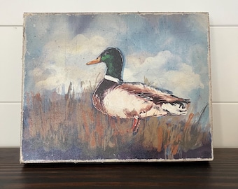 Vintage style duck canvas art with distressed finish. 11-3/4"W x 9-1/2"H