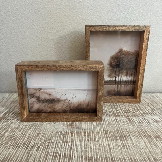 Double sided mango wood frame. Comes in two sizes. 8"x 6" holds a 5"x7" image. 5"x 7" holds a 4"x6" Image.