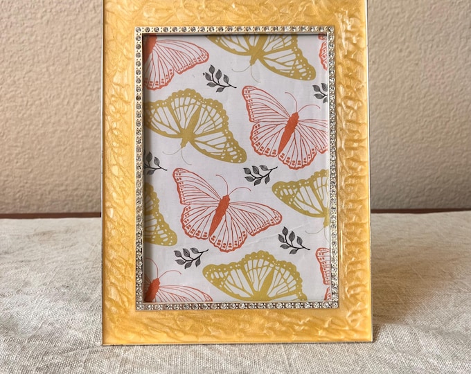 Vintage style yellow 8 1/2”x 6 1/2” frame with silver and rhinestone details holds a 6 1/2” x 4 1/2” image