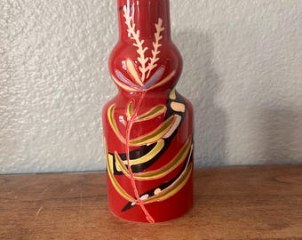 Small red bud vase with hand painted abstract floral detail 6"Hx 2 1/2"x1 "