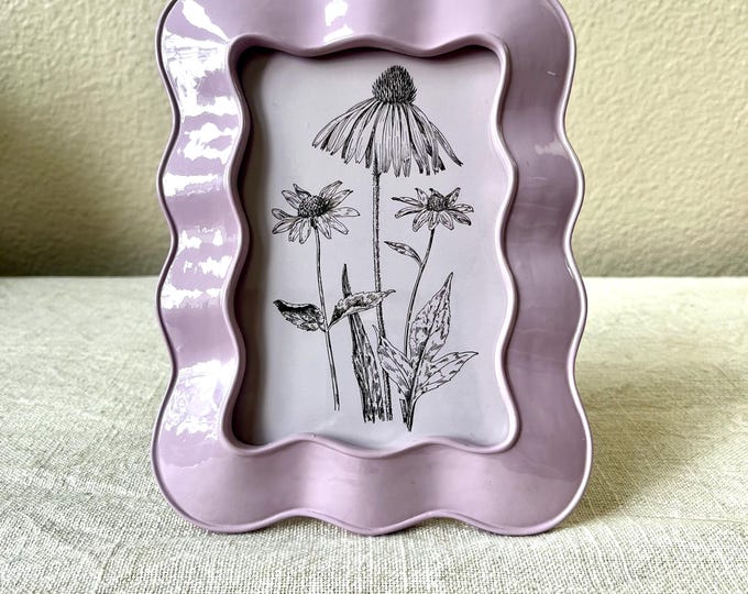 Vintage style lavender  7 1/2”x 5 3/4” resin frame holds a 3 ”x 5 1/2” photo