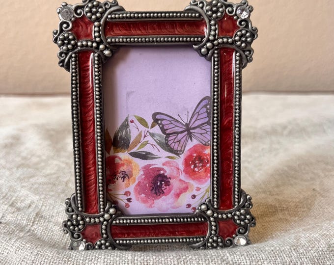 Vintage 3x4 red colored enameled frame with rhinestone details holds a 1 3/4" x 2 3/4" image