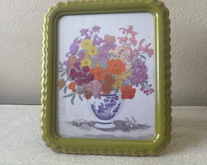 Scalloped green frame with gold finished edge holds a 8x10 image