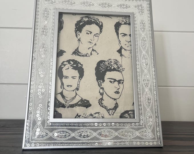 Vintage white lace and silver 5x7 frame holds a 4 1/2" x 6 1/2" image