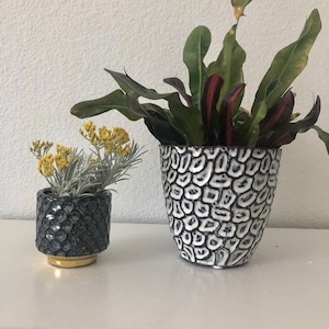 Navy blue, white and brown reactive glaze embossed planter. 5 1/2&quot;D x 5 1/4&quot; H. Holds a 5&quot; plant. no drain holes