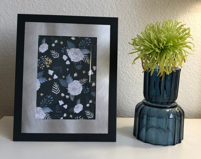 Vintage black and silver 8 x 10 photo frame hold a 5x7 image