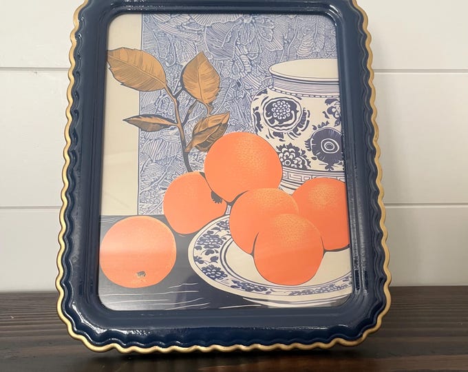 Scalloped blue frame with gold finished edge holds a 8x10 image