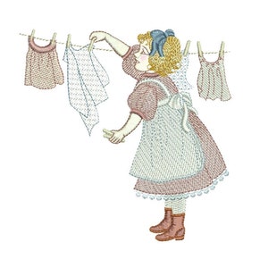 May include: A girl in a pink dress and white apron hangs clothes on a clothesline. The clothes are a white shirt, a pink and white striped shirt, and a pink and white striped dress.