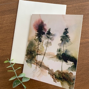 May include: Watercolor painting of three trees in a forest setting. The trees are painted in shades of green and brown, with a hint of purple in the background. The painting is on a white background.