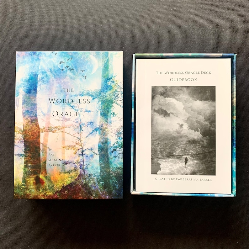 May include: A box set for the Wordless Oracle deck, featuring a blue and green watercolor-style image of trees and a full moon. The box includes a guidebook with a black and white photo of a person walking on a beach with a cloudy sky.