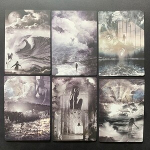 May include: Six black and white tarot cards with various images of clouds, water, and figures. The cards are arranged in two rows of three.
