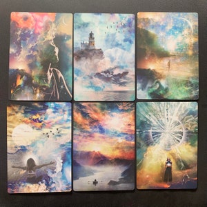 May include: Six colorful cards with abstract images of clouds, sky, water, and figures. The cards have a watercolor-like appearance and feature a variety of colors, including blue, green, pink, and yellow.
