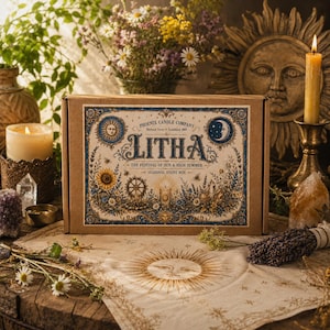 May include: A rectangular cardboard box labeled Litha The Festival of Sun & High Summer by Phoenix Candle Company. The box features intricate illustrations of sunflowers, a sun, a moon, and floral motifs in blue, gold, and brown ink tones.