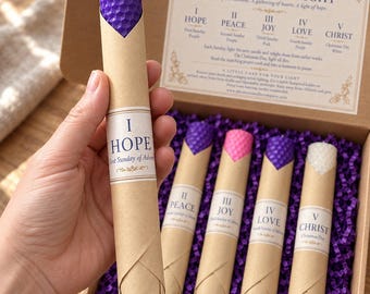 May include: A set of five honeycomb-textured taper candles in a cardboard box. Each candle is wrapped in brown paper with a label reading I Hope, II Peace, III Joy, IV Love, or V Christ. The box includes a printed guide titled A Season of Light.