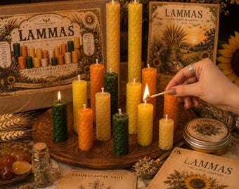 May include: A collection of beeswax candles in shades of yellow, orange, and green with a honeycomb texture, arranged on a wooden tray. The set includes a box labeled Lammas, a guide book, a small tin, and a glass vial, with one candle being lit.
