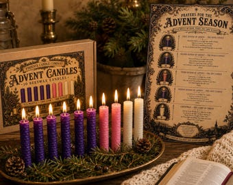 May include: A set of ten beeswax candles in purple, pink, and white, arranged on an oval tray with pine branches. The set includes a cardboard box labeled Phoenix Candle Company Advent Candles and a printed card titled Prayers for the Advent Season.