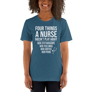 May include: A teal blue t-shirt with white text that reads "Four things a nurse doesn't play about: her stethoscope, her feelings, her coffee, her pens". A white stethoscope icon is next to the text.