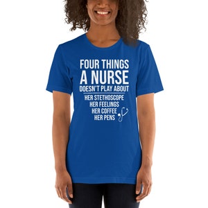 May include: A royal blue t-shirt with white text that reads "Four things a nurse doesn't play about: her stethoscope, her feelings, her coffee, her pens". A white stethoscope icon is next to the text.