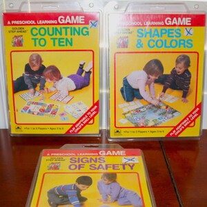 Nieuwe vintage jaren 80 Golden Step Ahead voorschoolse leergames: kies uit tellen tot tien!! / Vormen en kleuren / Veiligheidssymbolen NIB