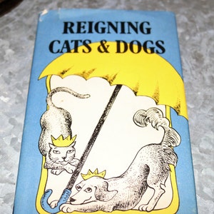 Reigning Cats and Dogs Hardcover 1988 by Lois L. Kaufman (Author) Illustrations by Martha Holland Bartsch