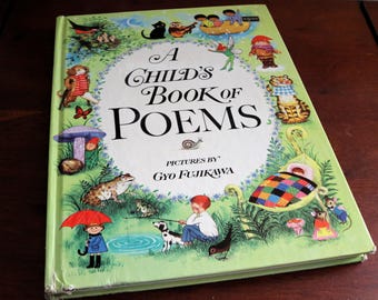 May include: A hardcover book titled A Child's Book of Poems with pictures by Gyo Fujikawa. The light green cover features colorful illustrations of children, animals, fairies, and nature scenes surrounding the central black text title.