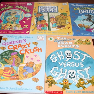 May include: A collection of five Berenstain Bears children's books featuring titles Maniac Mansion, Drug Free Zone, The Galloping Ghost, Queenie's Crazy Crush, and Ghost Versus Ghost, all authored by Stan and Jan Berenstain with colorful illustrations.