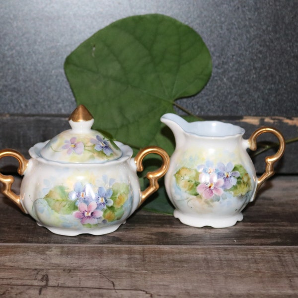 Vintage Mid-Century Hand-Painted Porcelain Lidded Sugar Bowl and Creamer Colorful Floral Pink Lavender Gold Violets Hand-Signed