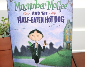 Mucumber McGee and the Half-Eaten Hot Dog Relié avec jaquette 2007 de Patrick Loehr (Auteur, Illustrateur)