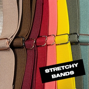 May include: A close-up of several colorful stretchy bands with metal hardware. The bands are in shades of tan, brown, burgundy, coral, yellow, and green. The text "STRETCHY BANDS" is displayed on a black rectangle.