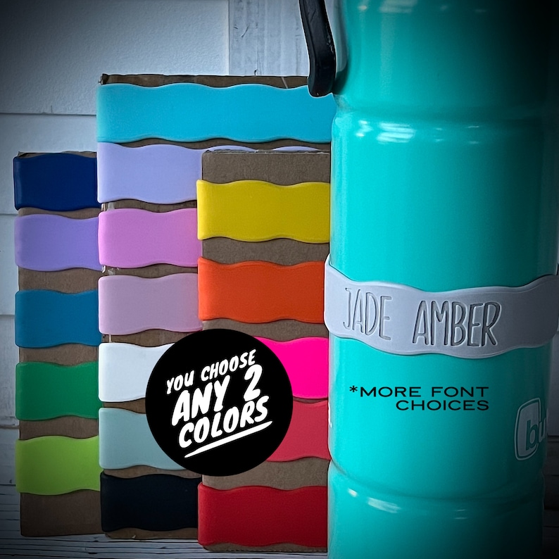 May include: A turquoise water bottle with a white band that says "JADE AMBER" and "*MORE FONT CHOICES".  The bottle is surrounded by a stack of colorful silicone bottle sleeves. A black circle with white text says "YOU CHOOSE ANY 2 COLORS".