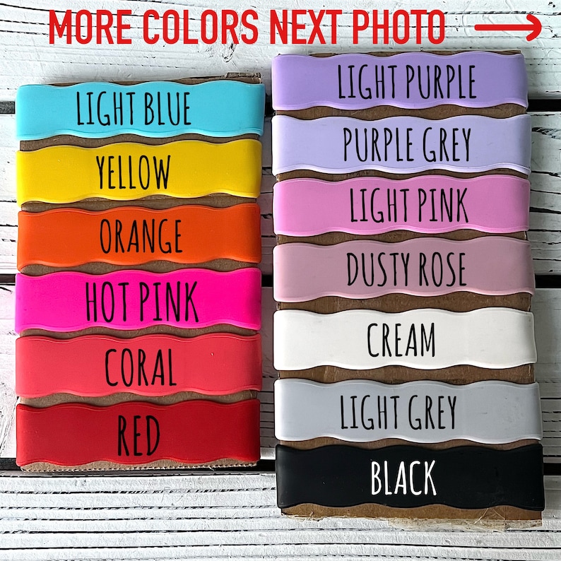 May include: A variety of silicone wristbands in different colors, including light blue, yellow, orange, hot pink, coral, red, light purple, purple grey, light pink, dusty rose, cream, light grey, and black. The wristbands are arranged in two rows, with the colors on the left side of the image and the colors on the right side of the image. The text "MORE COLORS NEXT PHOTO" is written above the wristbands.