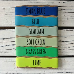 May include: Six different colored silicone wristbands with the following text: Dark Blue, Blue, Seafoam, Soft Green, Grass Green, Lime.
