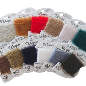 May include: A collection of Wisper brand cross-stitch thread in various colors, including green, white, brown, red, tan, pink, teal, dark brown, navy, and gray. Each spool is labeled with the brand name and product information.