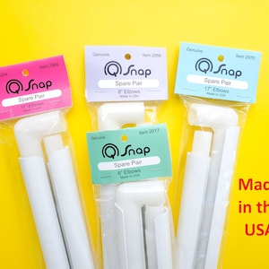 May include: Four packs of white plastic Q-Snap spare elbows in various sizes: 6 inches, 8 inches, 11 inches, and 17 inches. Each pack has a colourful label with the Q-Snap logo and the size of the elbows. The text "Made in the USA" is written in red on a yellow background.