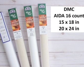 May include: Four packages of DMC Aida fabric for cross stitch. The packages are labeled "Gold Standard" and "Fiddler's Aida" and show the fabric in white and natural colors. The packages are labeled with the count of the fabric, 16 count, and the size of the fabric, 15 x 18 inches and 20 x 24 inches.