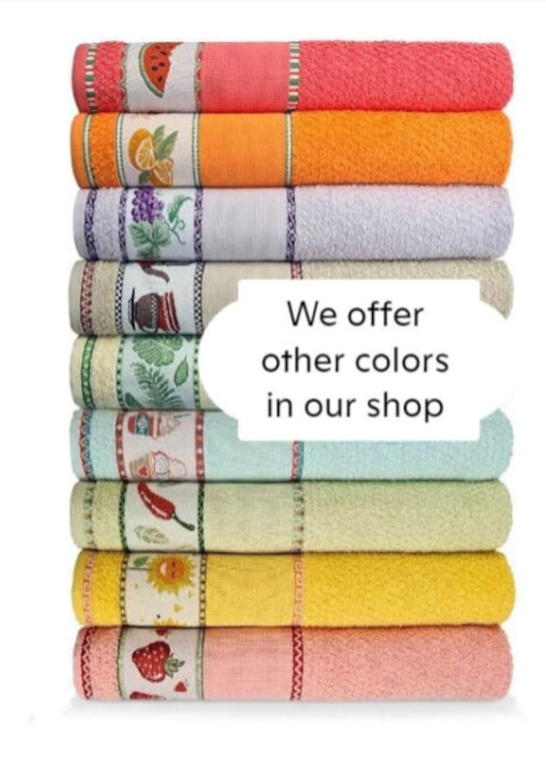 May include: A stack of colorful kitchen towels with fruit and vegetable designs. The towels are in shades of pink, orange, white, light blue, beige, green, yellow, and peach. The text "We offer other colors in our shop" is displayed.