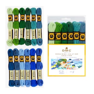 May include: A collection of DMC tapestry wool skeins in shades of green, blue, and teal. The image includes individual skeins and a packaged set labeled "Ocean & Sky" with the DMC logo and text in English, French, and Spanish.