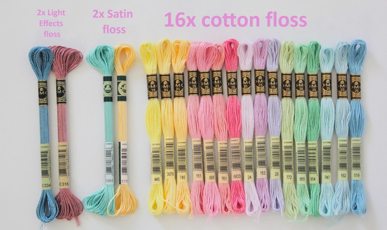 May include: A collection of embroidery floss in various colors, including pink, yellow, blue, and green. The image shows 2 skeins of light effects floss, 2 satin floss skeins, and 16 cotton floss skeins. Text on the image reads "16x cotton floss."