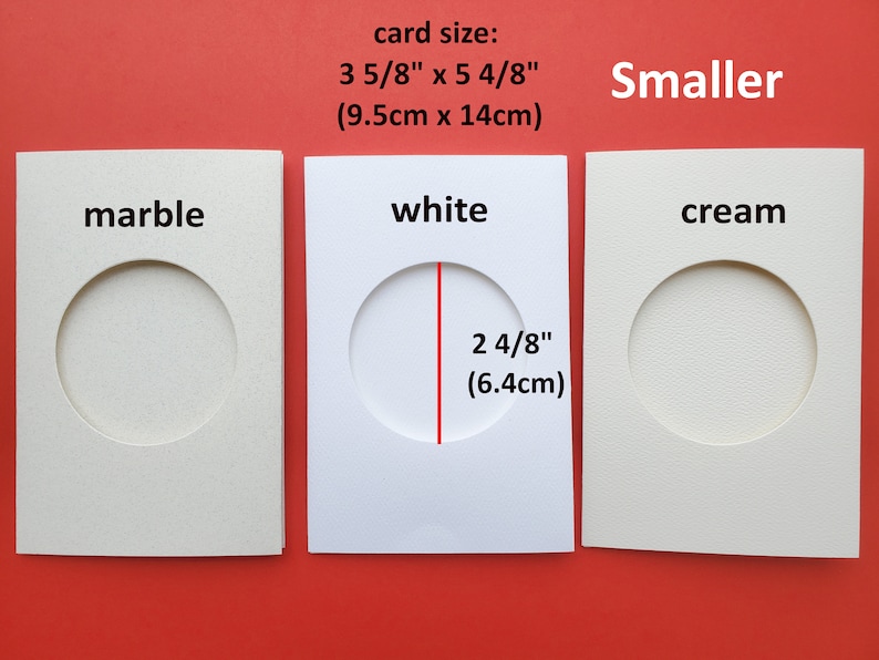 May include: Three cardstock cards with different colored backgrounds and a round hole cut out. The cards are labeled "marble", "white", and "cream". The card size is 3 5/8 inches by 5 4/8 inches (9.5 cm x 14 cm). The hole size is 2 4/8 inches (6.4 cm).