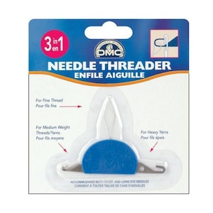 May include: A blue and white plastic needle threader with the text "3 in 1" and "Needle Threader" on the packaging. The threader has three different sized loops for threading needles of different sizes. The packaging also includes the text "Enfile Aiguille" in French.